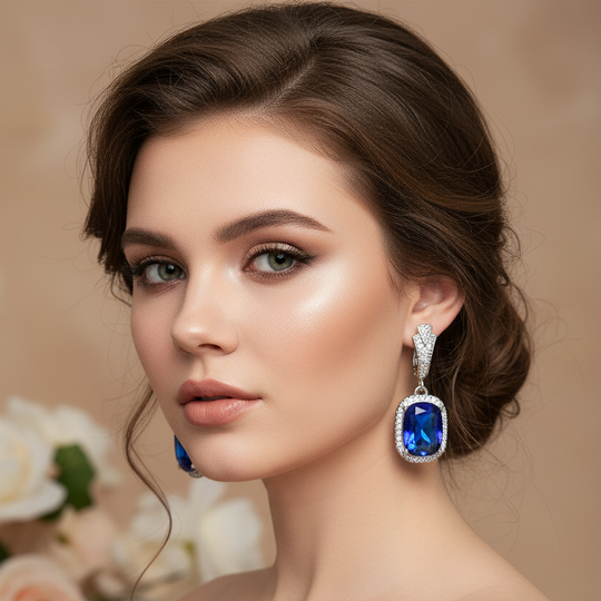 Model wearing blue crystal earrings