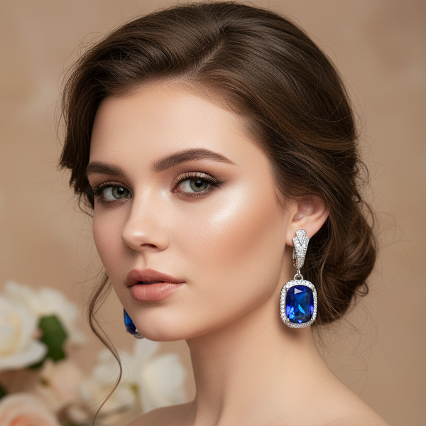 Model wearing blue crystal earrings